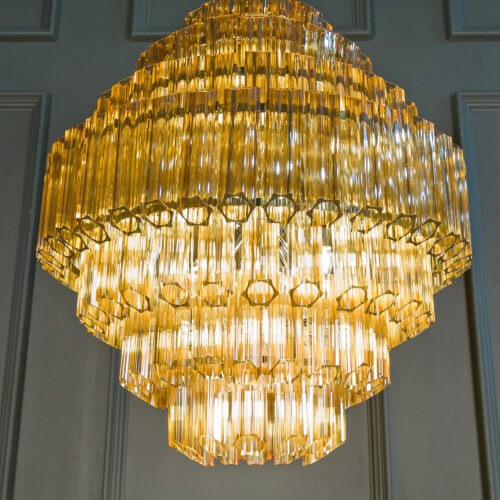 large amber yellow tiered chandelier in style of Murano glass