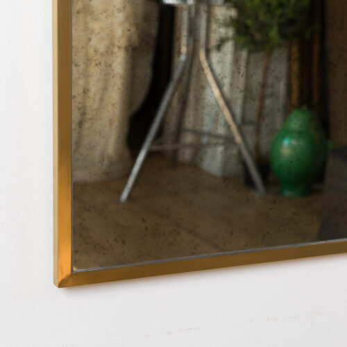 aged dressing mirror with brass frame