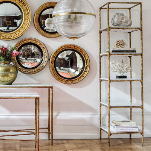 marble etagere bookcase with hammered effect brass metalwork