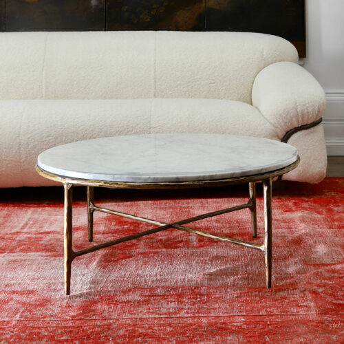 round marble coffee table with hammered effect brass metalwork
