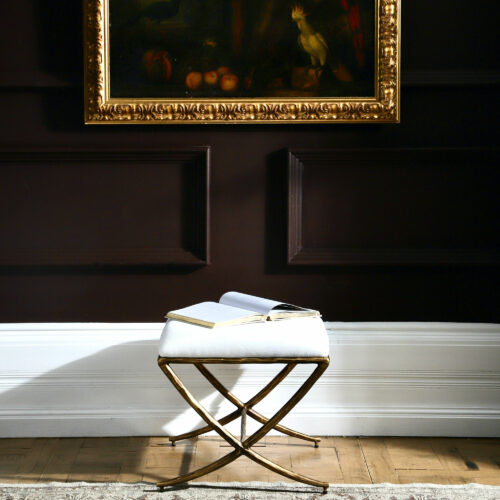 white linen stool with brass hammered effect metalwork