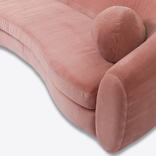 curved sofa in pink velvet