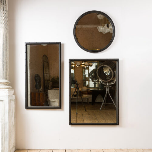 aged glass rectangular and circular mirror with a black industrial frame ideal for hallways or living rooms