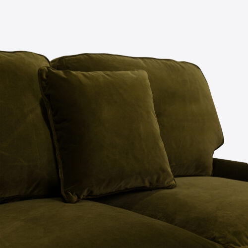 Baxter sofa - a traditional sofa on castors and upholstered in moss green coloured velvet