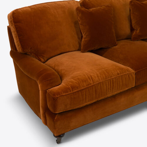 Baxter sofa - a traditional sofa on castors and upholstered in rust coloured velvet