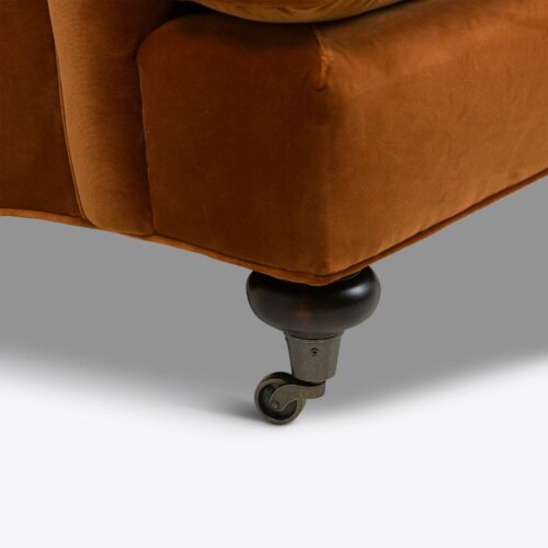 Rust velvet traditional armchair on castors