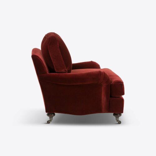 red velvet traditional armchair on castors
