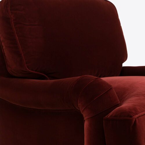red velvet traditional armchair on castors