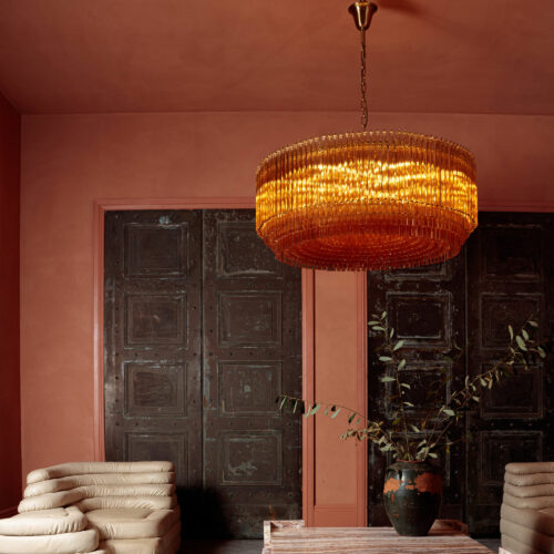 Grande_Amaro_chandelier_in_amber_glass_over_square_marble_coffee_table-3