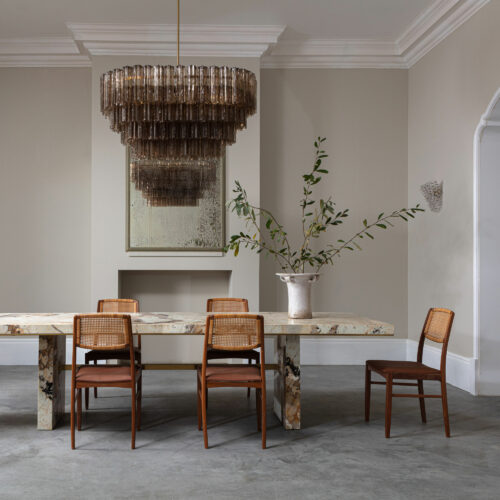 mid-century inspired dining chandelier in smoked quartz pink or clear glass with a Patagonia quartzite dining table