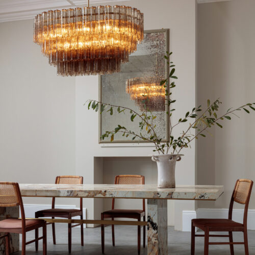 mid-century inspired dining chandelier in smoked quartz pink or clear glass with a Patagonia quartzite dining table