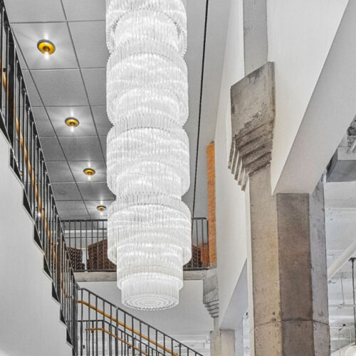 soho-works-NYC_bespoke-stair-case-stairwell-chandelier-block