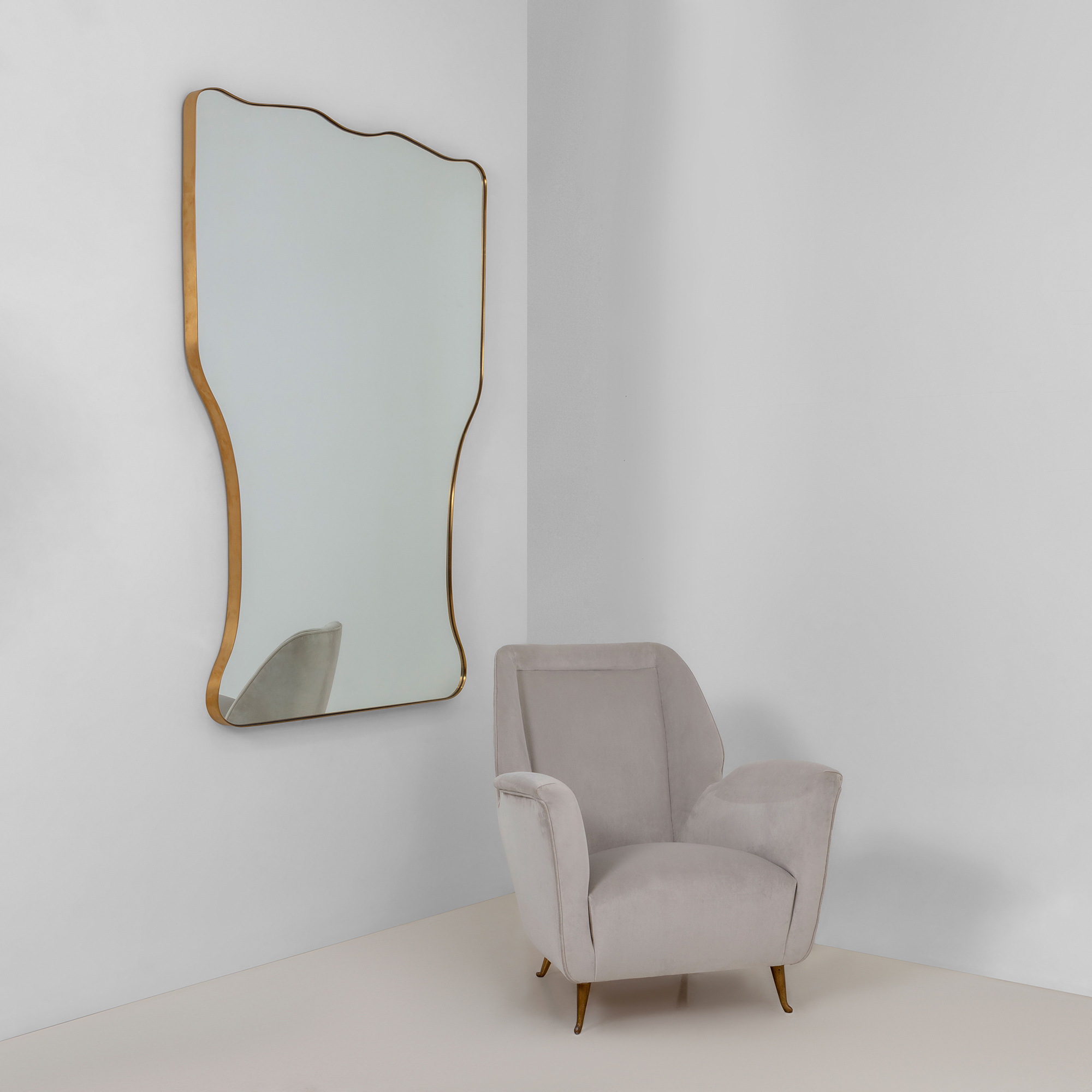 hourglass mid-century Italian style mirror with brass frame