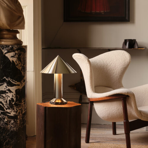 Stunning lighting with a lamp next to a chair