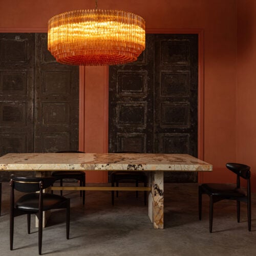 Grande_Amaro_chandelier_in_amber_glass_over_Patagonia_quartzite_dining_table.jpg