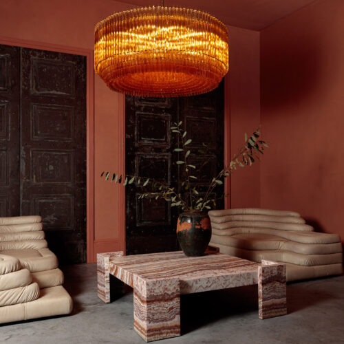 Grande_Amaro_chandelier_in_amber_glass_over_square_marble_coffee_table-2.jpg