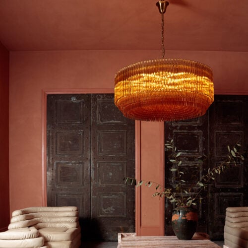Grande_Amaro_chandelier_in_amber_glass_over_square_marble_coffee_table-3.jpg