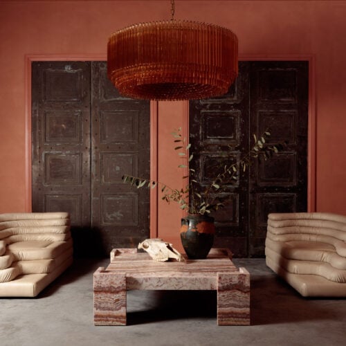 Grande_Amaro_chandelier_in_amber_glass_over_square_marble_coffee_table.jpg